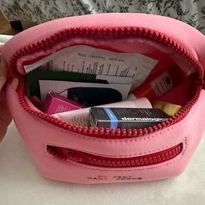 Marc Jacobs belt bag with beauty products